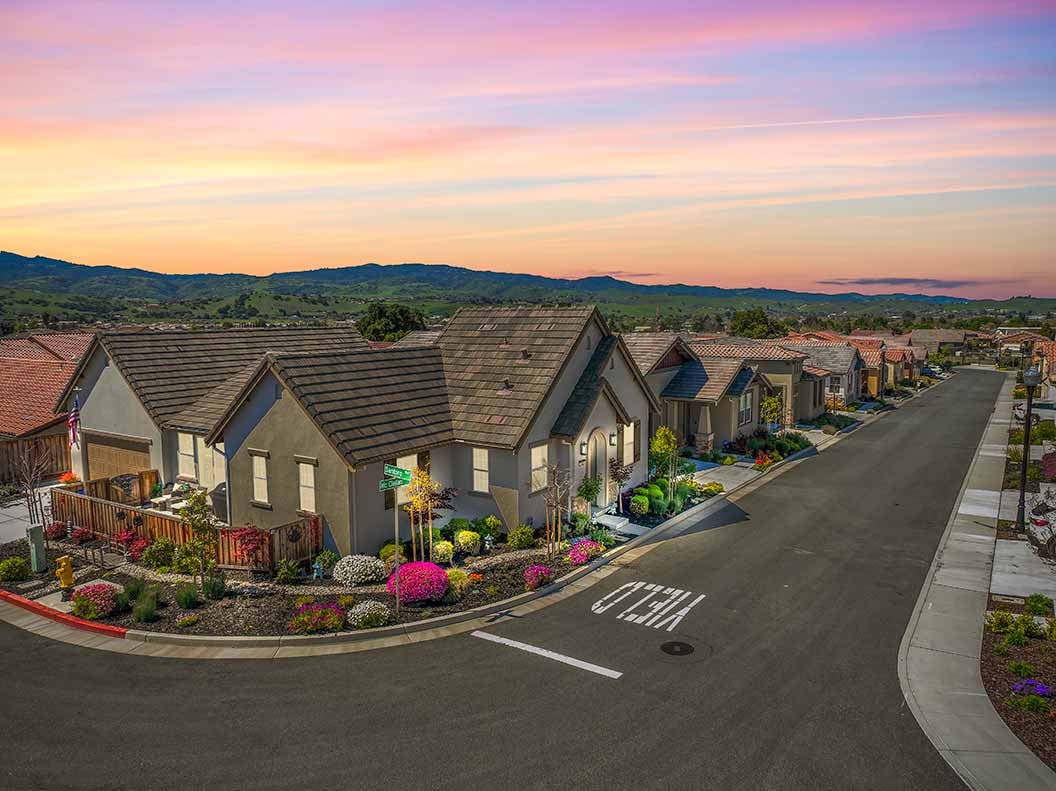 Aerial view of new home builder community at dusk