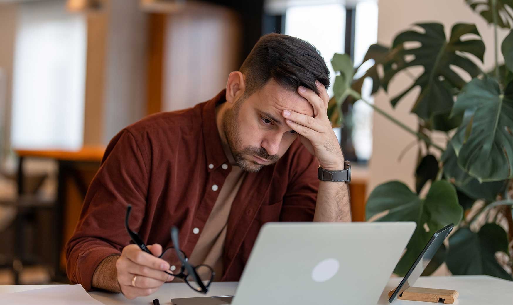 Frustrated-builder-executive-looking-at-data-on-computer