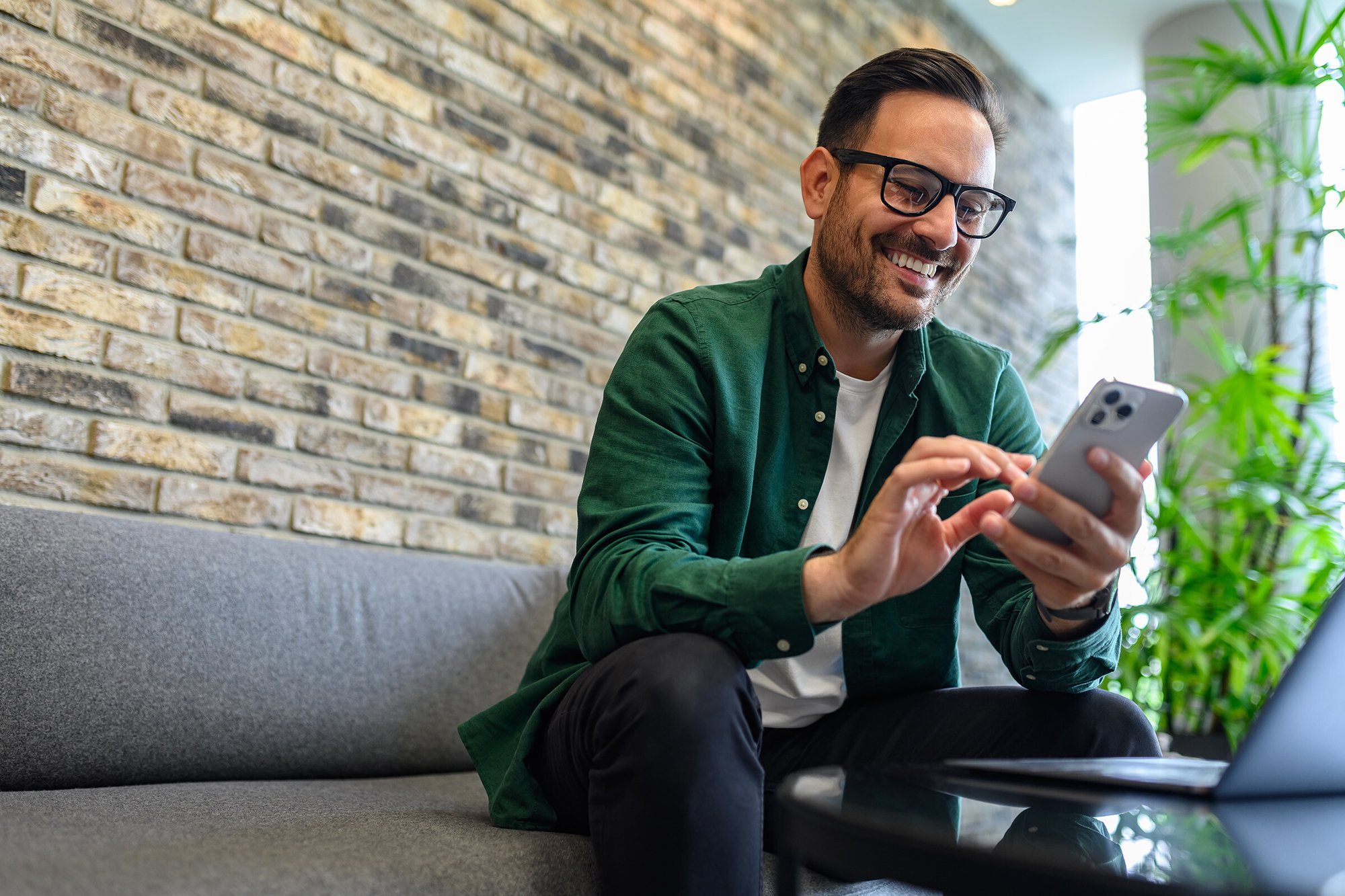 professional-man-smiling-at-phone